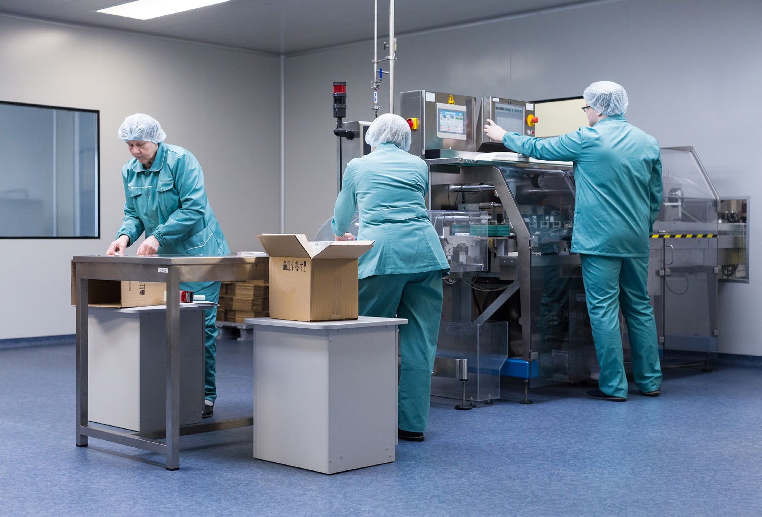 Jamjoom production team working on the factory floor.